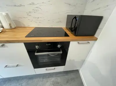 Cuisine ou kitchenette dans l'établissement Le logis du Gros Horloge - Cosy et Douillet