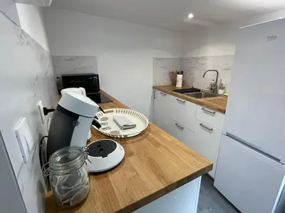 Cuisine ou kitchenette dans l'établissement Le logis du Gros Horloge - Cosy et Douillet