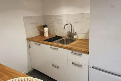 Cuisine ou kitchenette dans l'établissement Le logis du Gros Horloge - Cosy et Douillet
