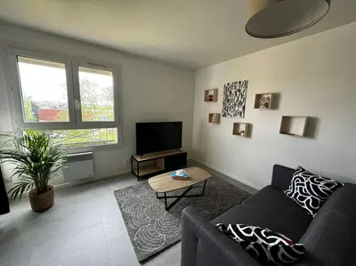 Télévision ou salle de divertissement dans l'établissement Un cocon tout confort