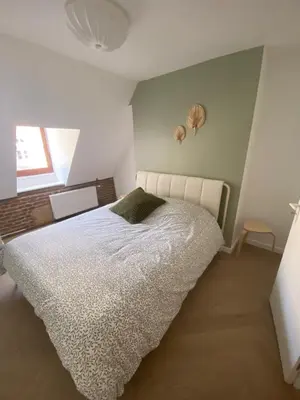Un ou plusieurs lits dans un hébergement de l'établissement APPARTEMENT VICTOR HUGO