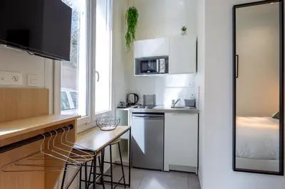 Cuisine ou kitchenette dans l'établissement Appartement 1 proche de la gare et du centre ville