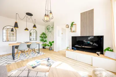 Télévision ou salle de divertissement dans l'établissement Le jardin d'hiver