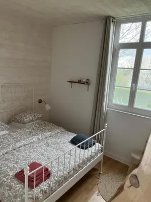 Un ou plusieurs lits dans un hébergement de l'établissement Maison Normandie