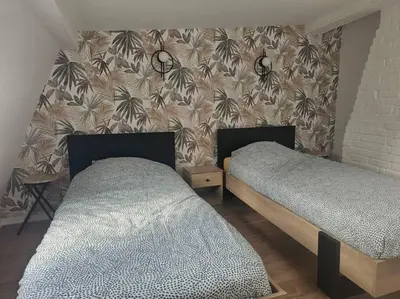 Un ou plusieurs lits dans un hébergement de l'établissement Le duplex Clieu BY HOLIDIEPPE