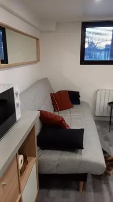 Coin salon dans l'établissement Appartement individuel en maison