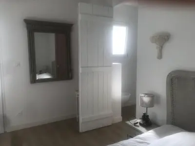 Un ou plusieurs lits dans un hébergement de l'établissement PROCHE MANOIR CAULIERES 2 rue d En Haut