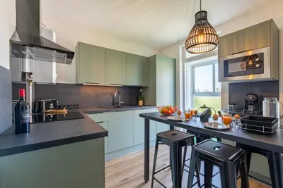 Cuisine ou kitchenette dans l'établissement Envole - moi