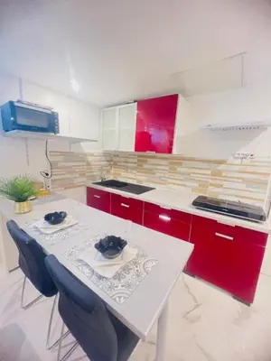 Cuisine ou kitchenette dans l'établissement Appartement indépendant chez l'habitant