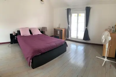 Un ou plusieurs lits dans un hébergement de l'établissement Petite maison à la campagne