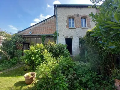 Jardin de l'établissement Maison dans charmant petit jardin