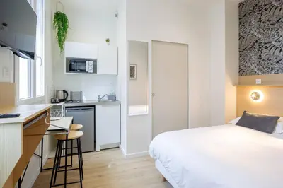 Cuisine ou kitchenette dans l'établissement Appartement 3 proche de la gare et du centre ville