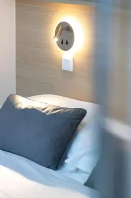 Un ou plusieurs lits dans un hébergement de l'établissement Appartement 3 proche de la gare et du centre ville