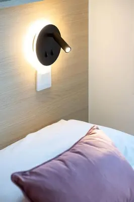 Un ou plusieurs lits dans un hébergement de l'établissement Appartement 4 proche de la gare et du centre ville