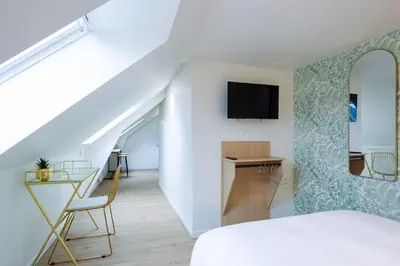 Télévision ou salle de divertissement dans l'établissement Appartement 6 proche de la gare et du centre ville
