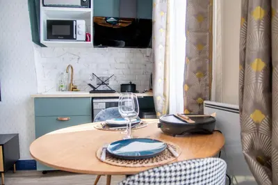 Cuisine ou kitchenette dans l'établissement Appartement tout confort