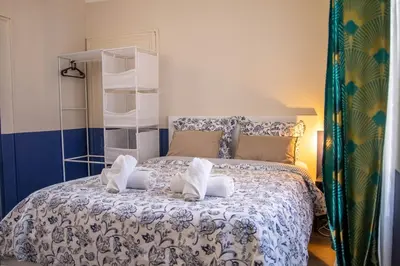 Un ou plusieurs lits dans un hébergement de l'établissement Appartement tout confort