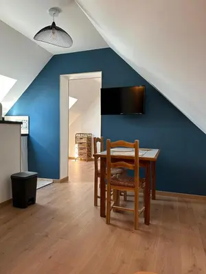 Télévision ou salle de divertissement dans l'établissement Au cosy