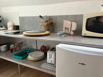 Cuisine ou kitchenette dans l'établissement L'Herbe de grâce