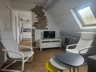 Télévision ou salle de divertissement dans l'établissement Le Port Vauquelin BY HOLIDIEPPE
