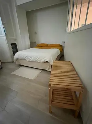 Un ou plusieurs lits dans un hébergement de l'établissement Beau studio dans un cadre exceptionnel de verdure