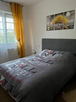 Un ou plusieurs lits dans un hébergement de l'établissement Maison de vacances
