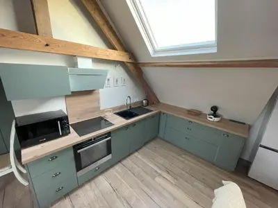 Cuisine ou kitchenette dans l'établissement le gite de la pommeraie