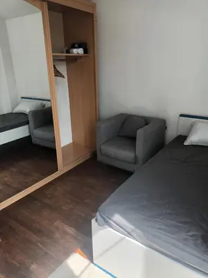 Un ou plusieurs lits dans un hébergement de l'établissement Appartement f3