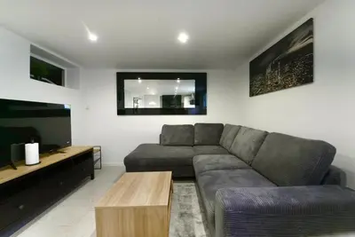Télévision ou salle de divertissement dans l'établissement Appartement tout confort