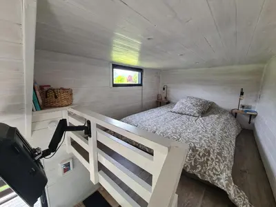Un ou plusieurs lits dans un hébergement de l'établissement Tiny House