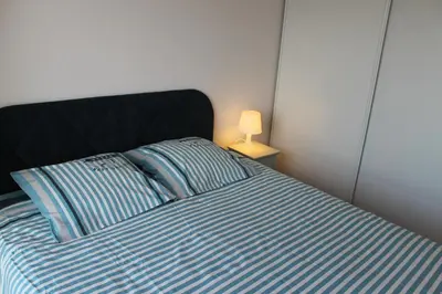 Un ou plusieurs lits dans un hébergement de l'établissement MAGNIFIQUE APPARTEMENT et AVEC VUE SUR MER