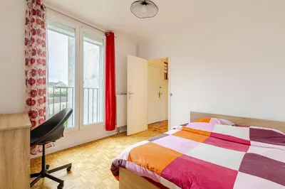 Un ou plusieurs lits dans un hébergement de l'établissement appartement proche paris et Roissy