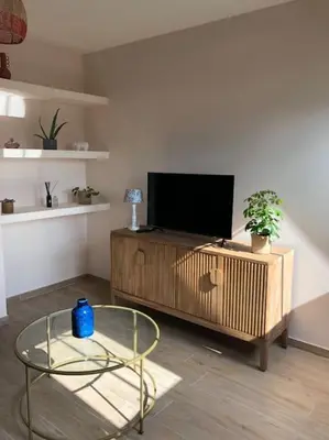 Télévision ou salle de divertissement dans l'établissement Appartement F2