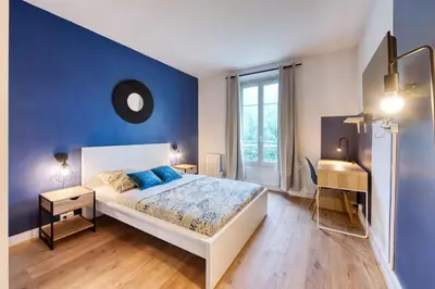 Un ou plusieurs lits dans un hébergement de l'établissement Appartement Rénové