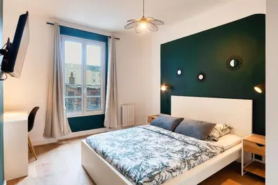Un ou plusieurs lits dans un hébergement de l'établissement Appartement Rénové