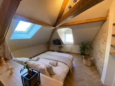 Un ou plusieurs lits dans un hébergement de l'établissement Le Chalet Dieppois