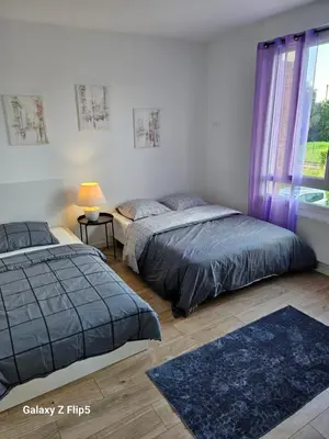 Un ou plusieurs lits dans un hébergement de l'établissement Magnifique Chambre Triple3