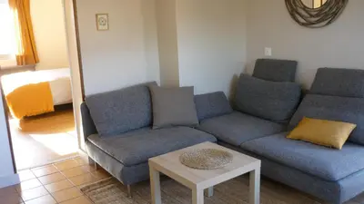 Coin salon dans l'établissement Appartement Chez Caroline