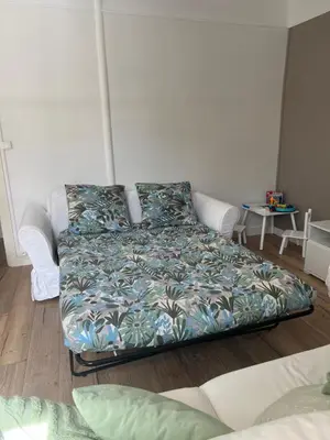 Un ou plusieurs lits dans un hébergement de l'établissement Appartement hyper-centre vue cathédrale