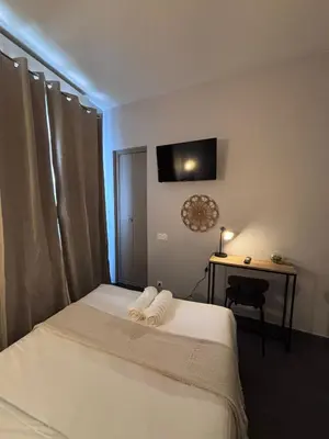 Un ou plusieurs lits dans un hébergement de l'établissement Hôtel Astrid