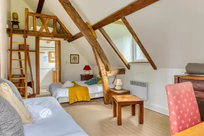 Un ou plusieurs lits dans un hébergement de l'établissement Gîte le Clos Saint Lucien - Fêtes Mariages Week end en Normandie