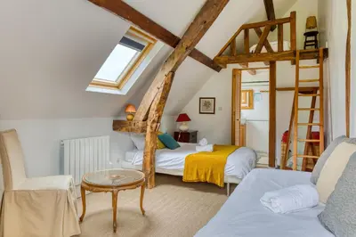 Un ou plusieurs lits dans un hébergement de l'établissement Gîte le Clos Saint Lucien - Fêtes Mariages Week end en Normandie