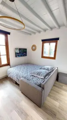 Un ou plusieurs lits dans un hébergement de l'établissement Appartement vue cathédrale