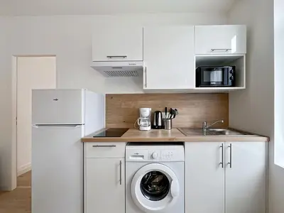 Cuisine ou kitchenette dans l'établissement Élégance en Centre-Ville - 336