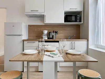 Cuisine ou kitchenette dans l'établissement Élégance en Centre-Ville - 336