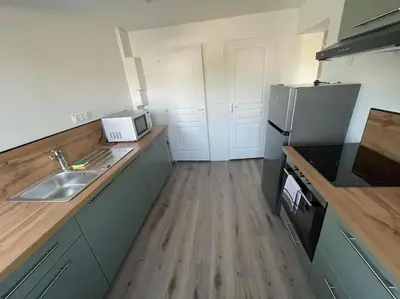 Cuisine ou kitchenette dans l'établissement Les 3G