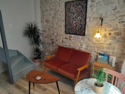 Coin salon dans l'établissement Gite La folie de Séraphine
