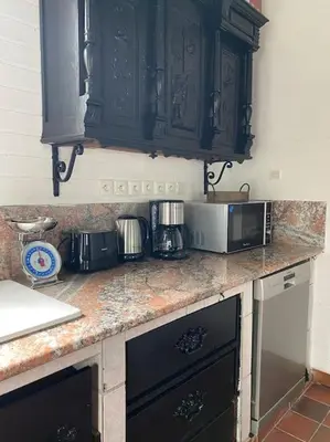 Cuisine ou kitchenette dans l'établissement Calme Normand