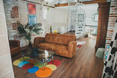Coin salon dans l'établissement LA LUCIOLE longère 65 m2 climatisée & lumineuse