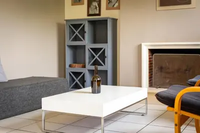 Coin salon dans l'établissement L'Olivier charmante maison avec parking et jardin